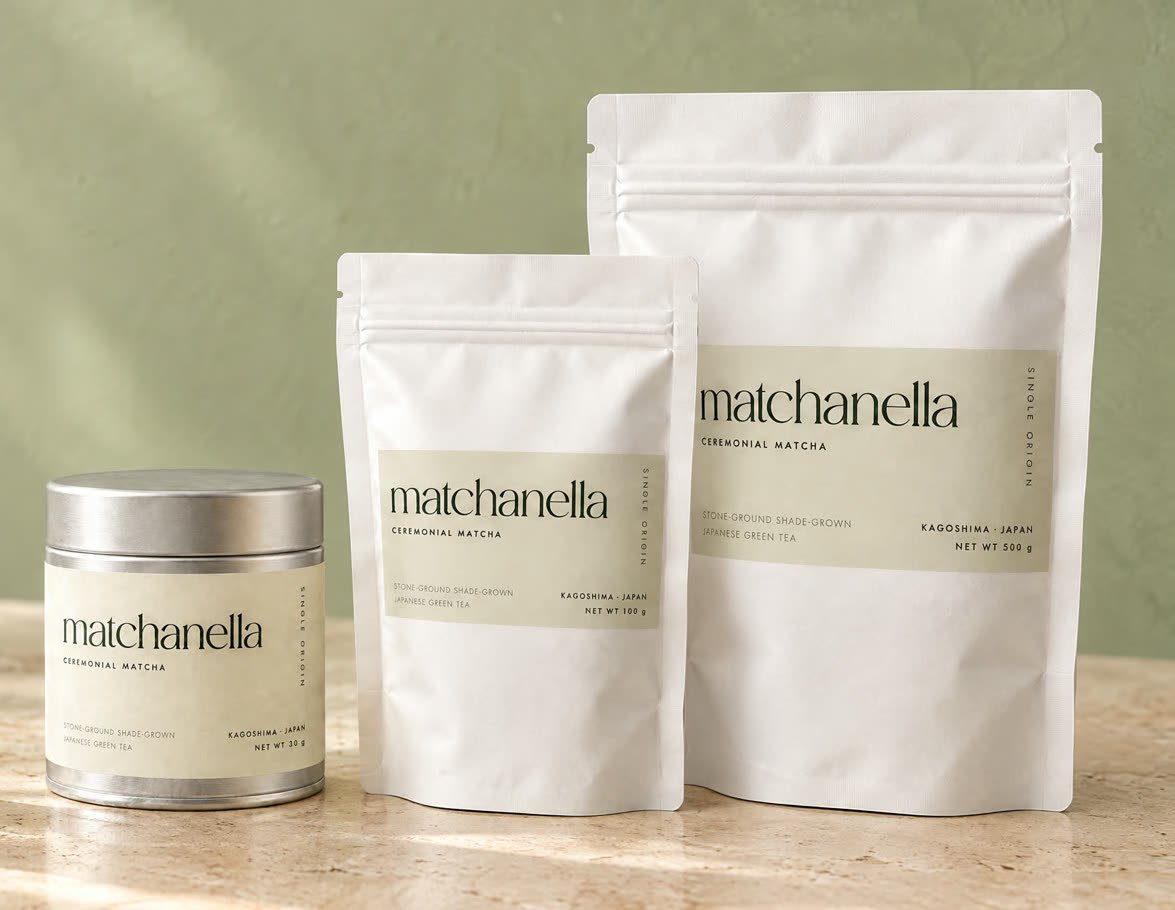 The matchanella 30 g tin, 100 g pouch and 500 g pouch on a sunlit beige counter.